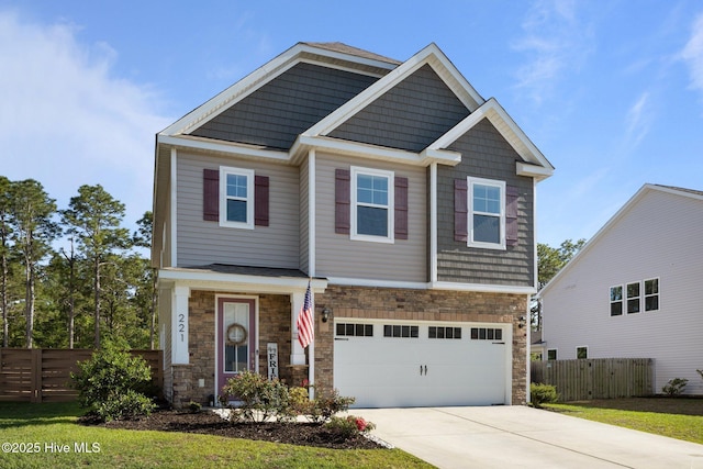 221 Salt Meadow Ln, Newport, NC 28570 - craftsman-style home featuring stone siding, concrete driveway, and fence