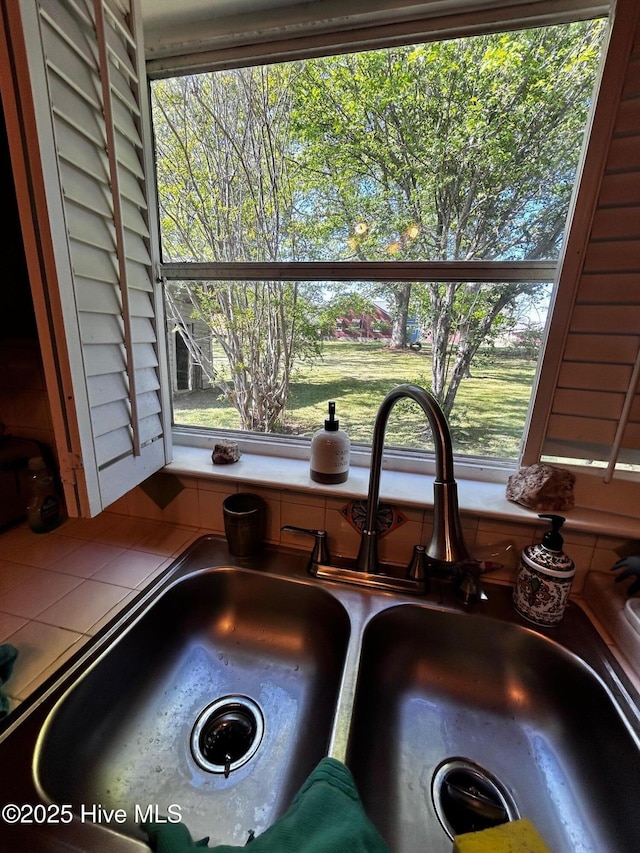 kitchen view of tile countertops and a sink