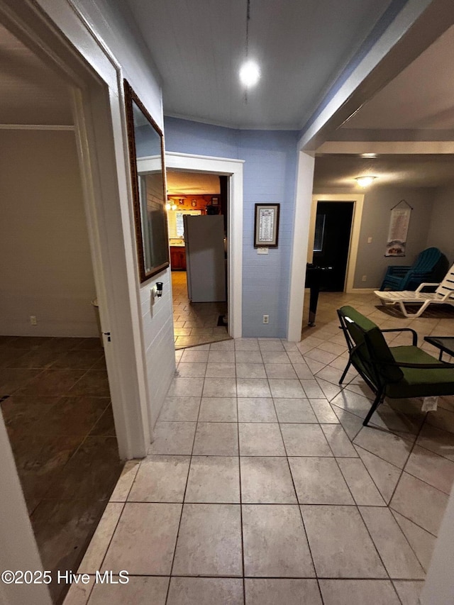 hall with light tile patterned flooring