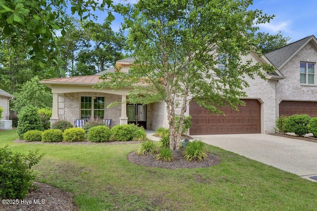 697 Jenoa Loop, Castle Hayne, NC 28429 - view of front of home with brick siding, a front yard, a standing seam roof, driveway, and metal roof