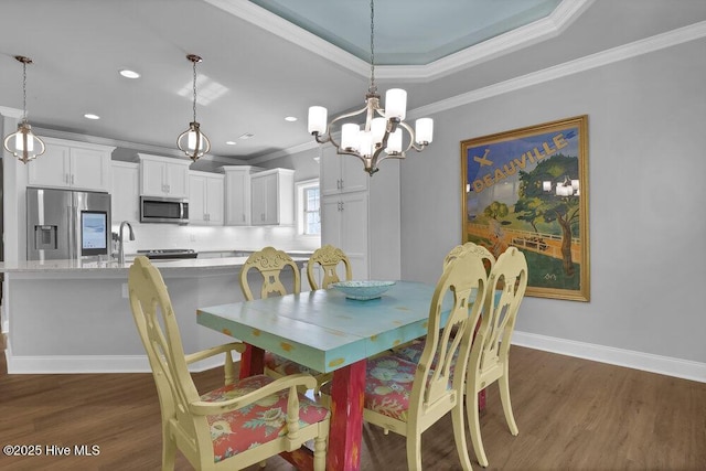 697 Jenoa Loop, Castle Hayne, NC 28429 - dining space with ornamental molding, wood finished floors, a chandelier, baseboards, and recessed lighting