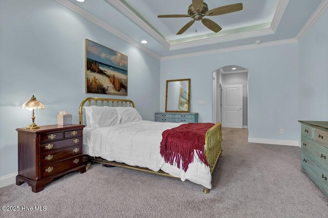 697 Jenoa Loop, Castle Hayne, NC 28429 - carpeted bedroom with arched walkways, crown molding, a tray ceiling, baseboards, and ceiling fan