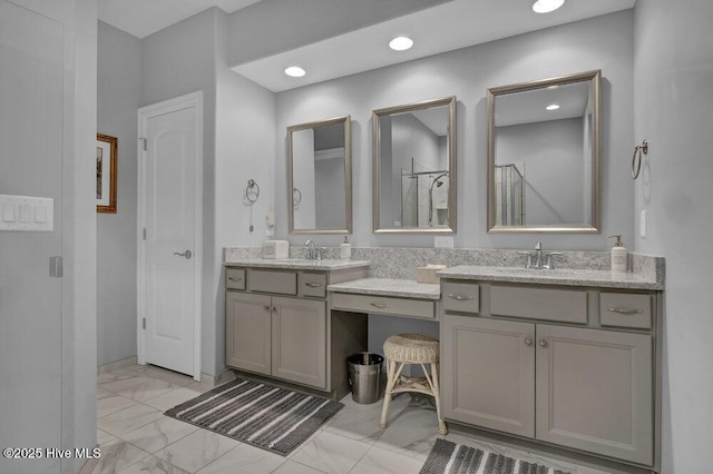 697 Jenoa Loop, Castle Hayne, NC 28429 - full bath featuring marble look tile flooring, vanity, and recessed lighting