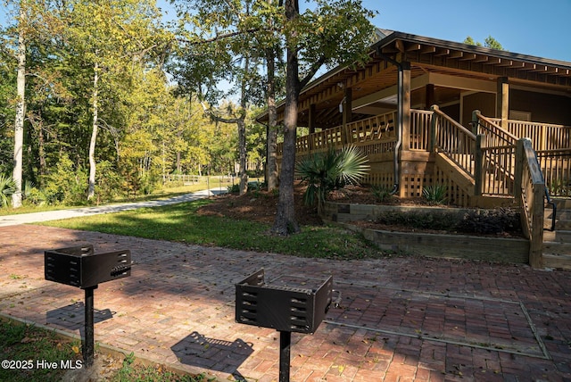697 Jenoa Loop, Castle Hayne, NC 28429 - view of home's exterior featuring stairs and a patio