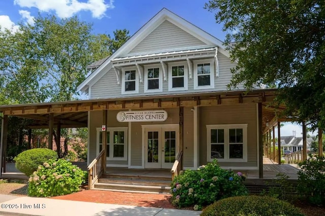 697 Jenoa Loop, Castle Hayne, NC 28429 - view of exterior entry featuring covered porch and french doors