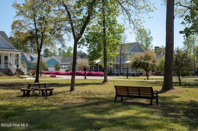 697 Jenoa Loop, Castle Hayne, NC 28429 - surrounding community featuring a lawn and a residential view