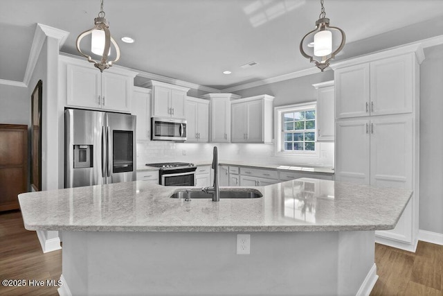 697 Jenoa Loop, Castle Hayne, NC 28429 - kitchen featuring stainless steel appliances, a sink, ornamental molding, backsplash, and white cabinetry
