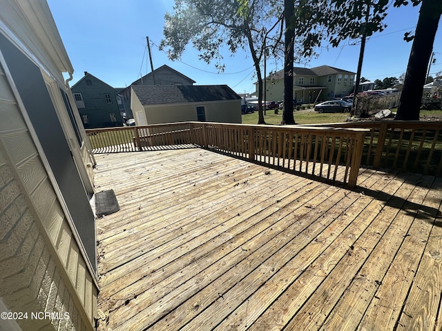 wooden terrace with a residential view