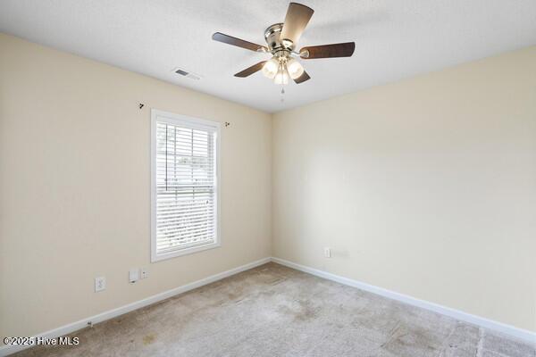 2610 Selkirk Ct, Wilmington, NC 28411 - carpeted empty room featuring baseboards and ceiling fan