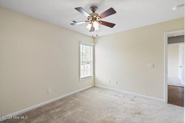 2610 Selkirk Ct, Wilmington, NC 28411 - carpeted spare room with baseboards and a ceiling fan