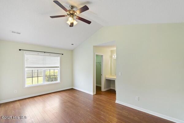 2610 Selkirk Ct, Wilmington, NC 28411 - empty room featuring ceiling fan, vaulted ceiling, wood finished floors, and baseboards