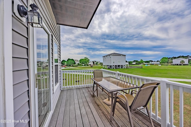 200 Twin Oaks Dr Unit B, Hampstead, NC 28443 - wooden deck featuring a yard