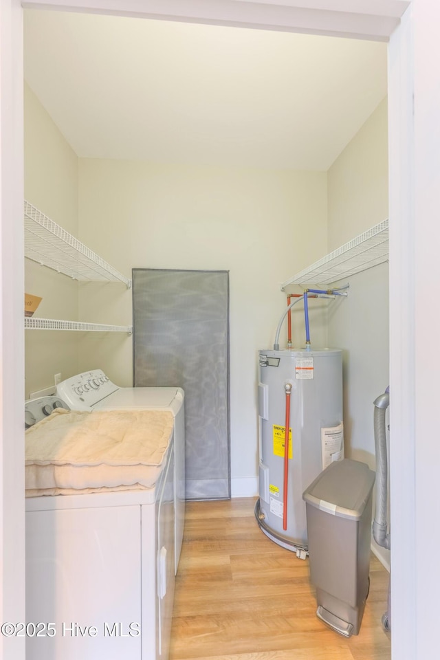 200 Twin Oaks Dr Unit B, Hampstead, NC 28443 - clothes washing area with washing machine and clothes dryer, electric water heater, and light wood-type flooring