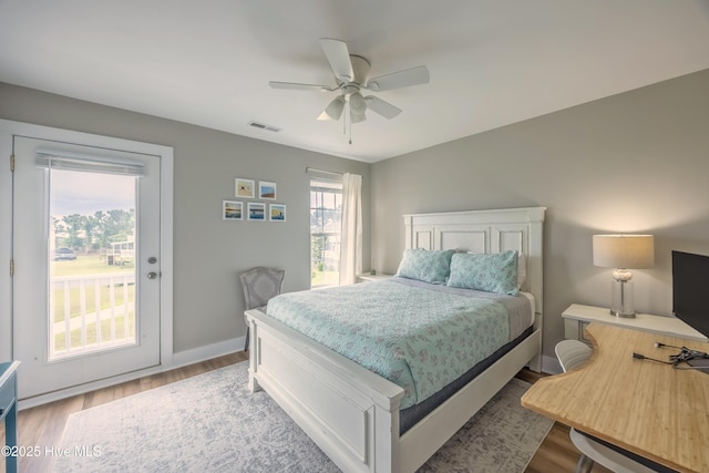 200 Twin Oaks Dr Unit B, Hampstead, NC 28443 - bedroom featuring access to outside, wood finished floors, baseboards, and a ceiling fan
