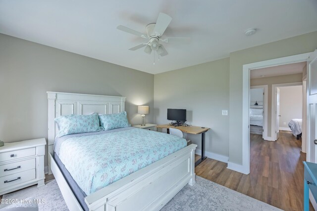200 Twin Oaks Dr Unit B, Hampstead, NC 28443 - bedroom featuring wood finished floors, baseboards, and ceiling fan