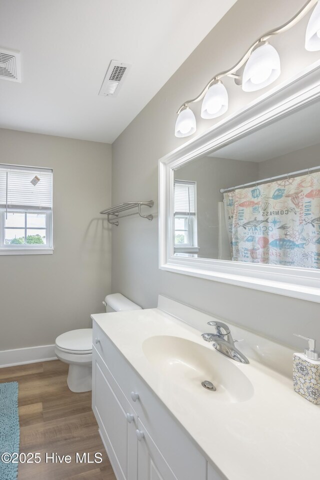 200 Twin Oaks Dr Unit B, Hampstead, NC 28443 - full bathroom with vanity, toilet, wood finished floors, and baseboards