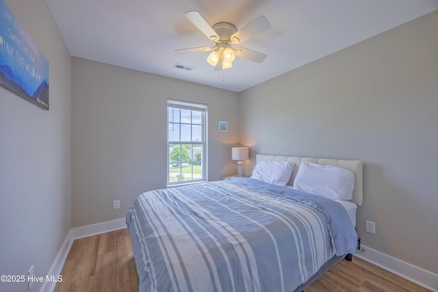 200 Twin Oaks Dr Unit B, Hampstead, NC 28443 - bedroom with baseboards, wood finished floors, and a ceiling fan