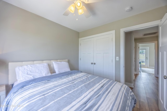 200 Twin Oaks Dr Unit B, Hampstead, NC 28443 - bedroom featuring dark wood-style floors, a closet, baseboards, and ceiling fan
