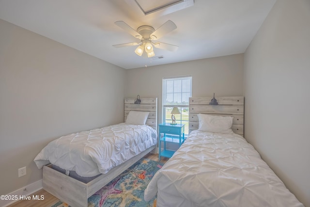 200 Twin Oaks Dr Unit B, Hampstead, NC 28443 - bedroom featuring wood finished floors, a ceiling fan, and baseboards