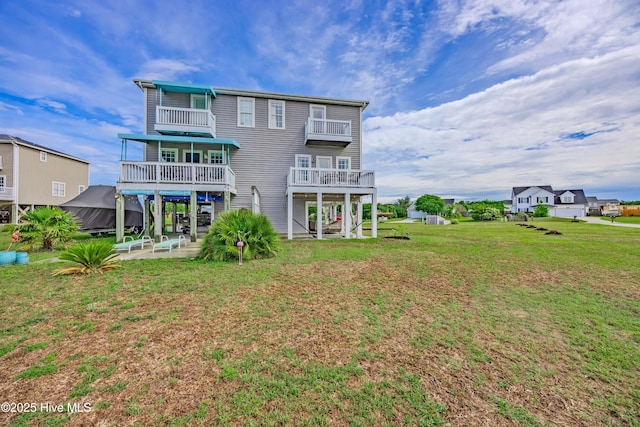 200 Twin Oaks Dr Unit B, Hampstead, NC 28443 - back of house featuring a patio, a lawn, and a balcony