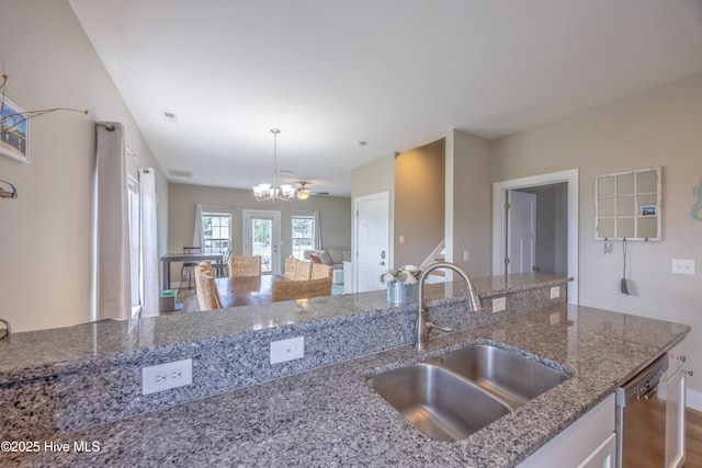 200 Twin Oaks Dr Unit B, Hampstead, NC 28443 - kitchen with a sink, dishwasher, a chandelier, light stone countertops, and decorative light fixtures