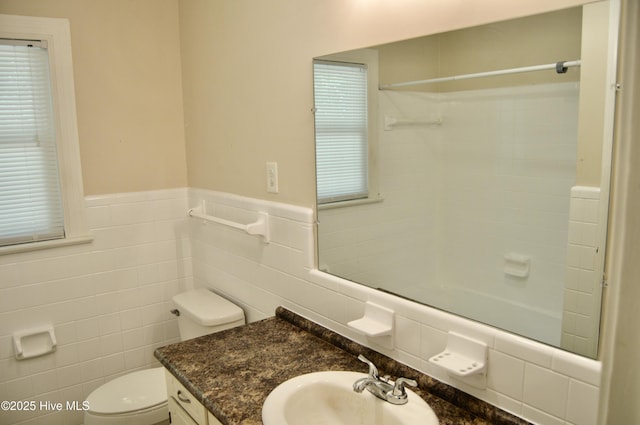 2692 Mt Herman Church Rd, Snow Hill, NC 28580 - full bathroom with tile walls, toilet, wainscoting, vanity, and a shower