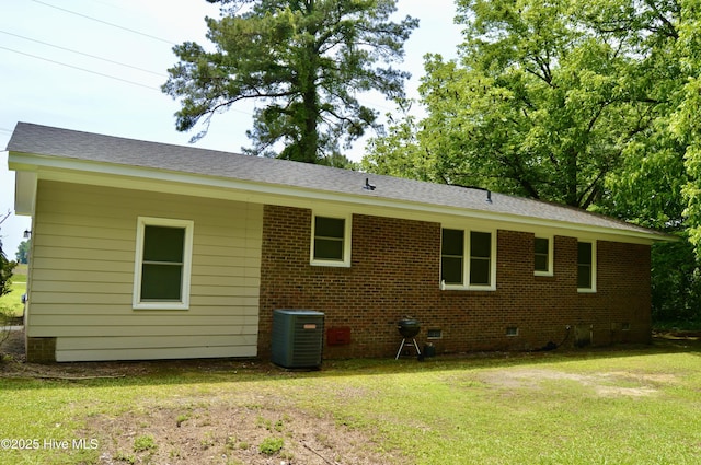 2692 Mt Herman Church Rd, Snow Hill, NC 28580 - back of property with crawl space, cooling unit, a yard, brick siding, and a shingled roof