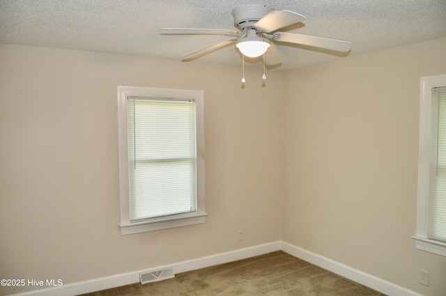 2692 Mt Herman Church Rd, Snow Hill, NC 28580 - spare room featuring light carpet, a ceiling fan, baseboards, and a textured ceiling