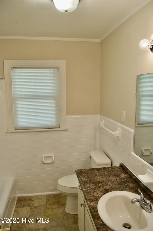 2692 Mt Herman Church Rd, Snow Hill, NC 28580 - full bath with tile walls, toilet, a wainscoted wall, ornamental molding, and vanity
