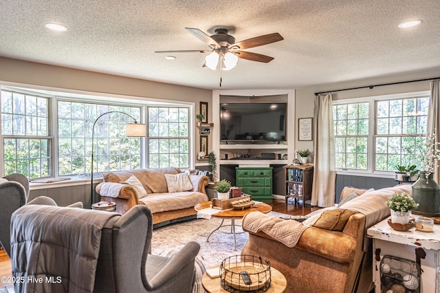 118 Lancashire Ln, West End, NC 27376 - living room with ceiling fan, a textured ceiling, wood finished floors, and recessed lighting