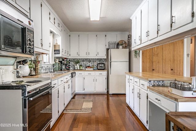 118 Lancashire Ln, West End, NC 27376 - kitchen featuring freestanding refrigerator, dishwashing machine, range with electric cooktop, dark wood-style floors, and white cabinetry
