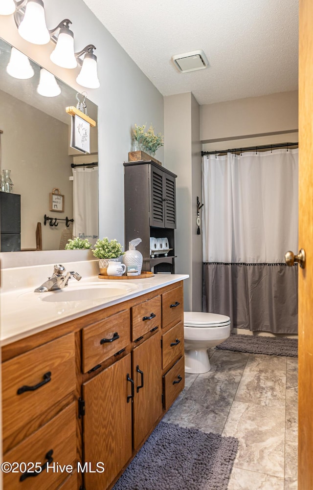 118 Lancashire Ln, West End, NC 27376 - bathroom with toilet, vanity, a shower with curtain, and a textured ceiling