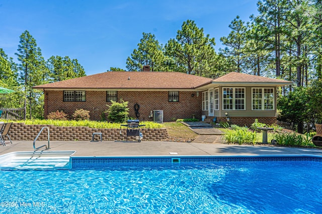 118 Lancashire Ln, West End, NC 27376 - view of pool featuring a patio, central AC unit, and area for grilling
