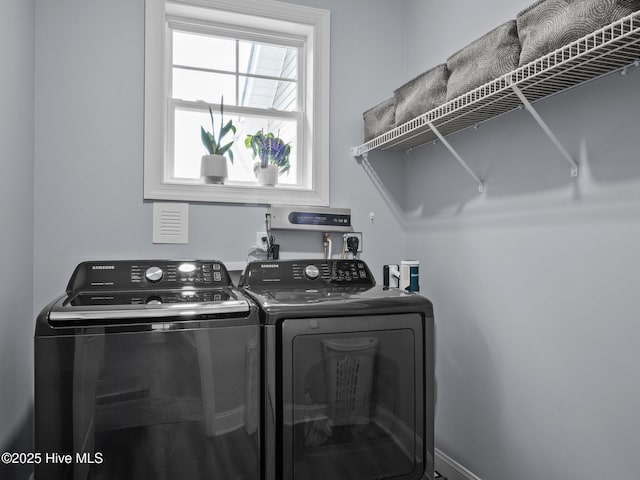 laundry area featuring independent washer and dryer