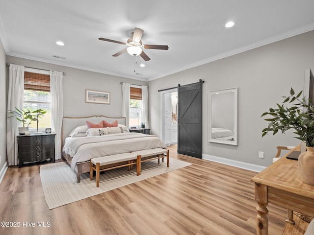 bedroom with a barn door, light wood-type flooring, baseboards, ornamental molding, and recessed lighting