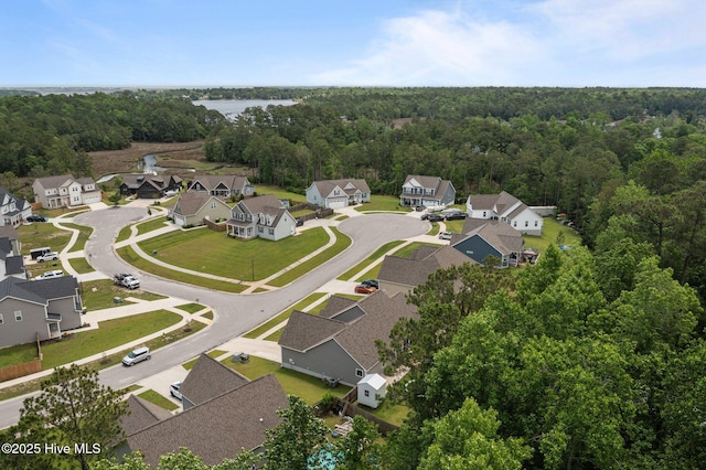 aerial perspective of suburban area with a heavily wooded area