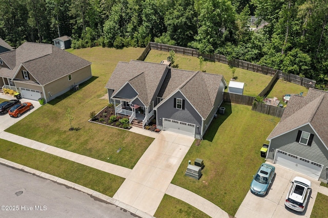 view of subject property featuring a heavily wooded area