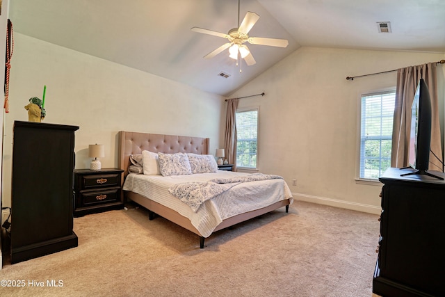 bedroom with multiple windows, vaulted ceiling, light carpet, and baseboards