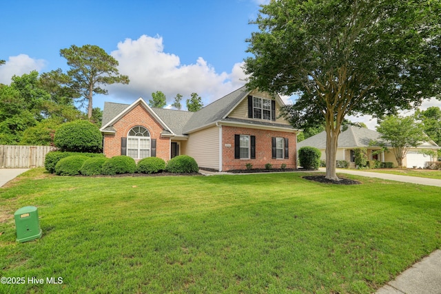 view of front facade featuring brick siding and driveway
