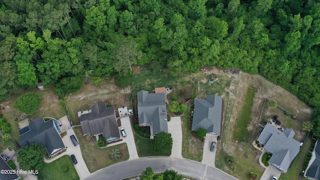 aerial view of property and surrounding area with nearby suburban area