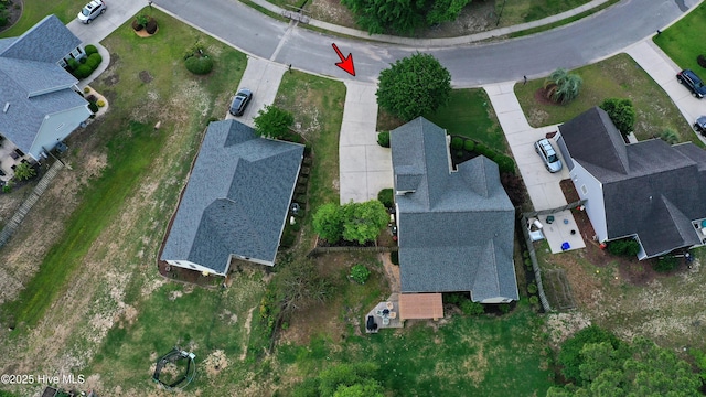 aerial view of property and surrounding area with nearby suburban area