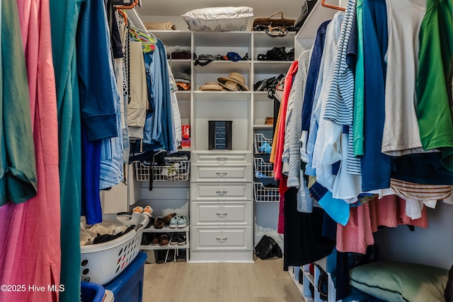 spacious closet with wood finished floors