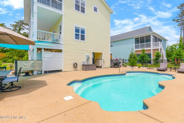 104 SE 32nd St, Oak Island, NC 28465 - view of pool with a patio area and fence