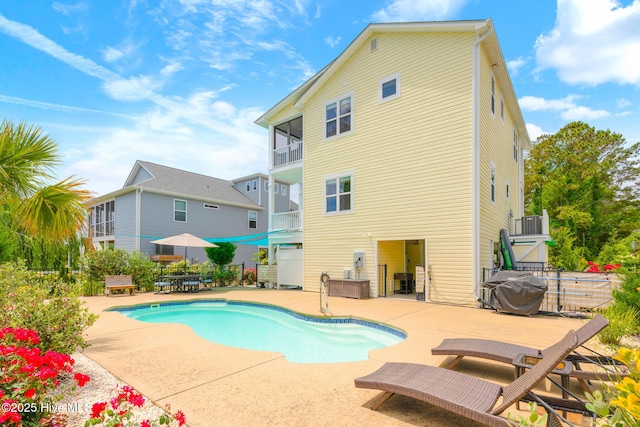 104 SE 32nd St, Oak Island, NC 28465 - view of pool featuring a patio, fence, and area for grilling