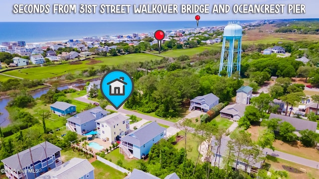 104 SE 32nd St, Oak Island, NC 28465 - aerial perspective of suburban area featuring a nearby body of water
