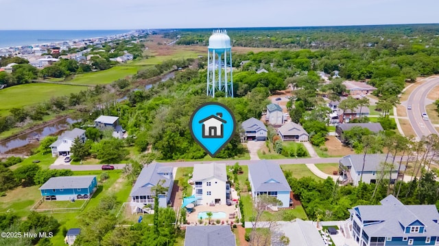 104 SE 32nd St, Oak Island, NC 28465 - aerial view of residential area featuring a large body of water
