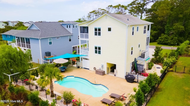 104 SE 32nd St, Oak Island, NC 28465 - rear view of property with a patio area and a balcony