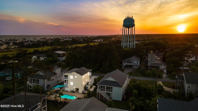 104 SE 32nd St, Oak Island, NC 28465 - aerial view at dusk of view of pool and a residential view