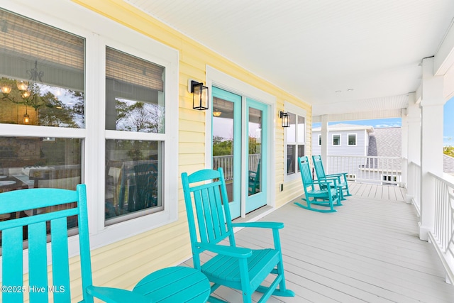 104 SE 32nd St, Oak Island, NC 28465 - wooden terrace with a porch