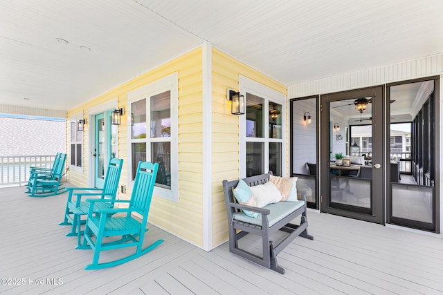 104 SE 32nd St, Oak Island, NC 28465 - wooden terrace featuring covered porch